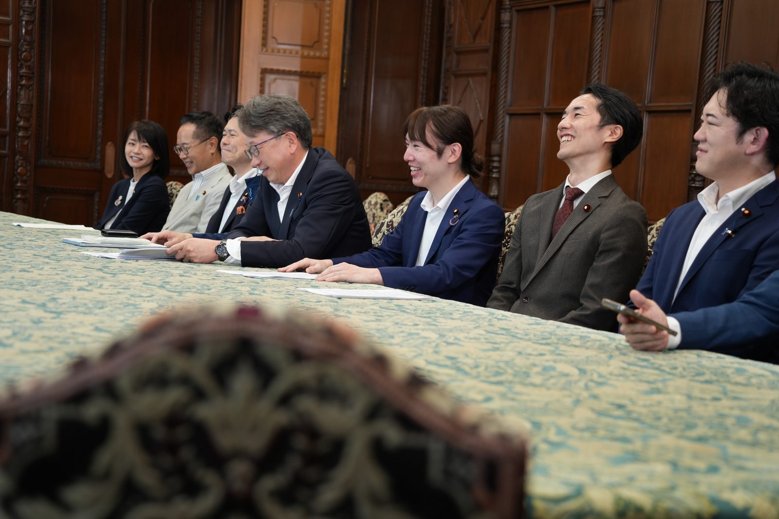 Eitaro Suda with lawmakers from other parties, handing over the cross-party proposal